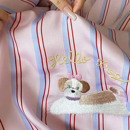 Pink satin pajama top with embroidered dog and gold hello detail from pink and red striped cool lyocell fiber blanket set decorbites cool lyocell