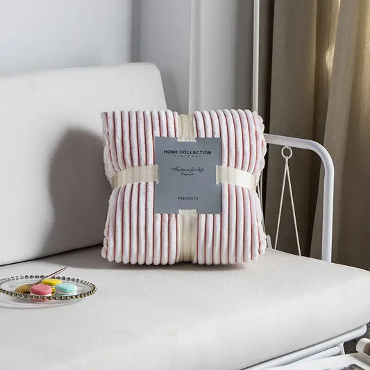 Pink ribbed plush throw blanket wrapped with cream ribbon decorbites cozy nordic wool for bedroom decor