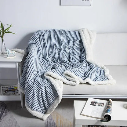 Cozy nordic wool throw blanket decorbites with light blue and white striped fleece and plush sherpa-lined edge