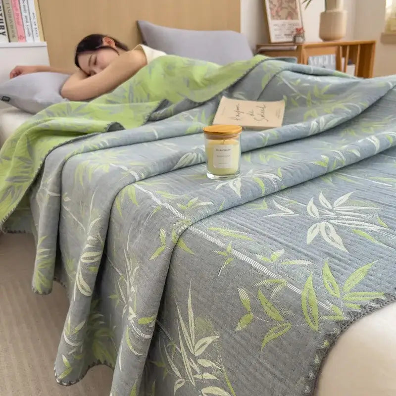 Soft gray decorbites cotton towel blanket with light green bamboo leaf pattern and textured weave for bedroom quilt use