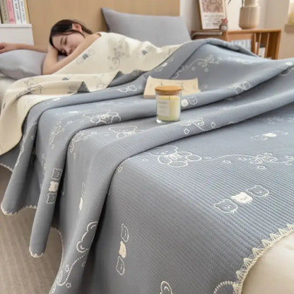 Gray quilted cotton towel blanket with embroidered white bear and cloud patterns from decorbites cotton towel collection