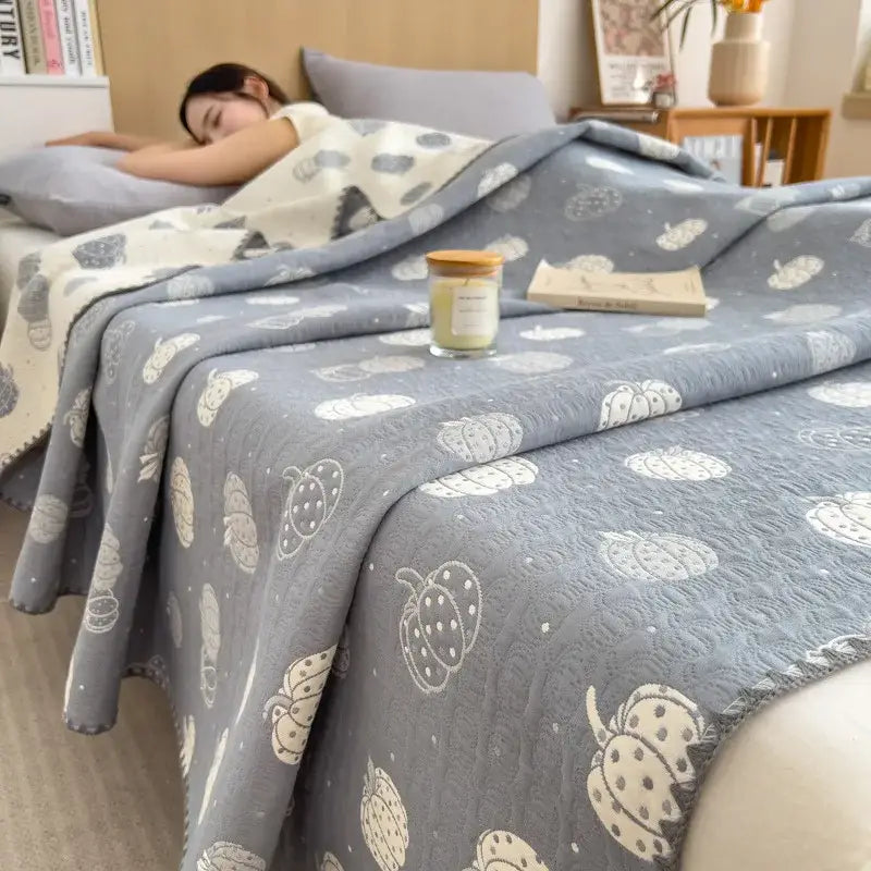Gray quilted cotton towel blanket with white and cream pumpkin pattern from decorbites cotton towel collection