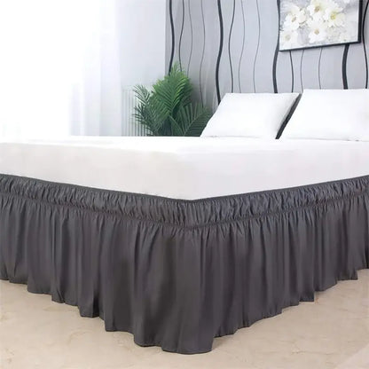 Dark gray ruffled elastic bed skirt with elasticized hem for a soft and solid color bedroom wrap around use