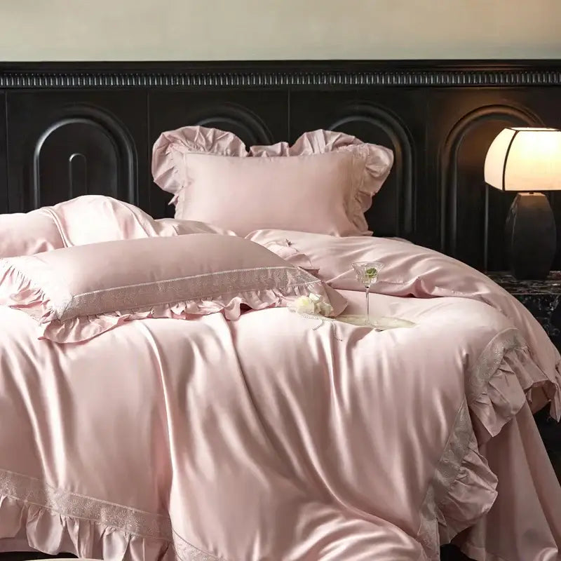 Soft pink satin bedding set with delicate ruffled edges and lace trim from decorbites 1000tc luxury embroidery collection