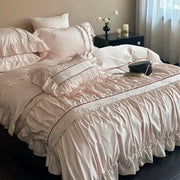 Pink satin bedding set with lace ruffles and floral embroidery made from decorbites 1000tc cotton for bedroom decor