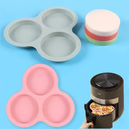 Pink silicone muffin pan with three circular cavities designed as an egg mold pancake shaper for kitchen use