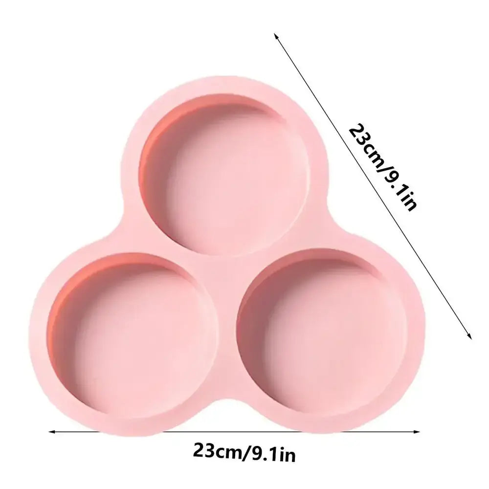 Pink silicone three-compartment food tray serving as an egg mold pancake shaper kitchen muffin pan