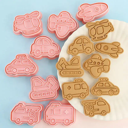 Set of pink silicone truck cookie cutters and aircraft shapes in a vehicle and aircraft cookie cutters set