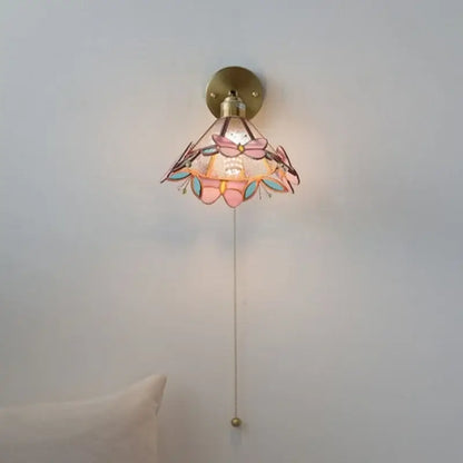 Pink and teal copper butterfly glass wall light with brass finish decorative butterfly-themed bedroom sconce