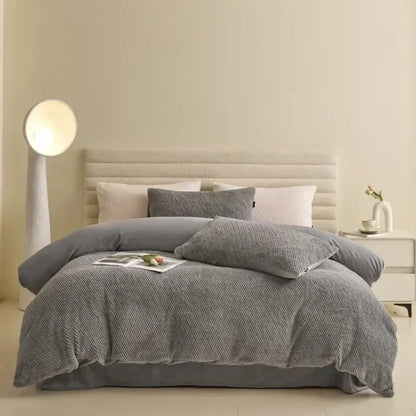 Gray textured duvet cover set with matching pillows in a winter fleece bedding set for cozy bedrooms