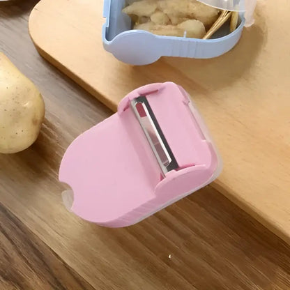 Pink translucent afralia snail peeler with metallic blade for kitchen vegetable peeling tool