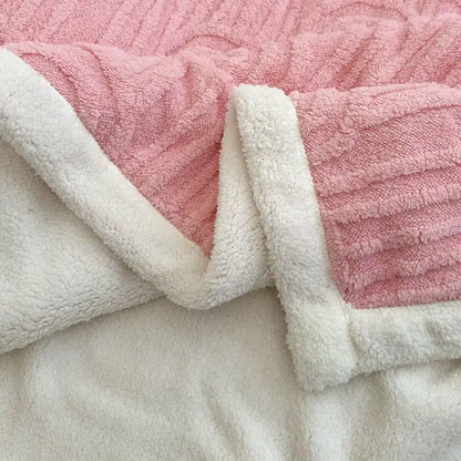 Pink and white double layered flannel plush blanket with ribbed texture and soft sherpa lining for bedroom use