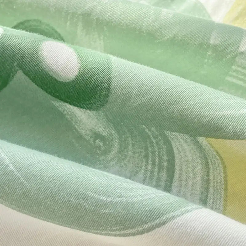 Light green cotton printed bedding set with subtle textured weave and soft white polka dots from decorbites cotton printed collection