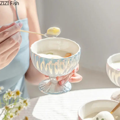 A delicate light blue ceramic dessert bowl with fluted texture and matching base from decorbites gradient gloss collection
