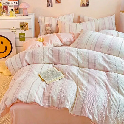 Soft pink and white striped jacquard cotton bedding set with textured waffle-knit pattern by decorbites