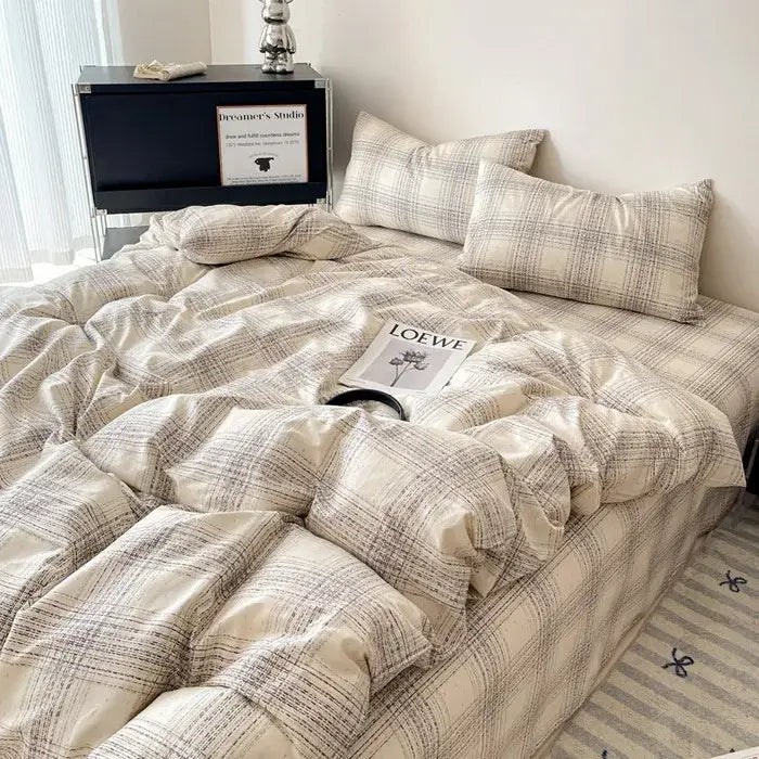 Plaid comforter bedding set in soft beige and muted gray with quilted texture and matching pillowcases from decorbites cotton grid collection