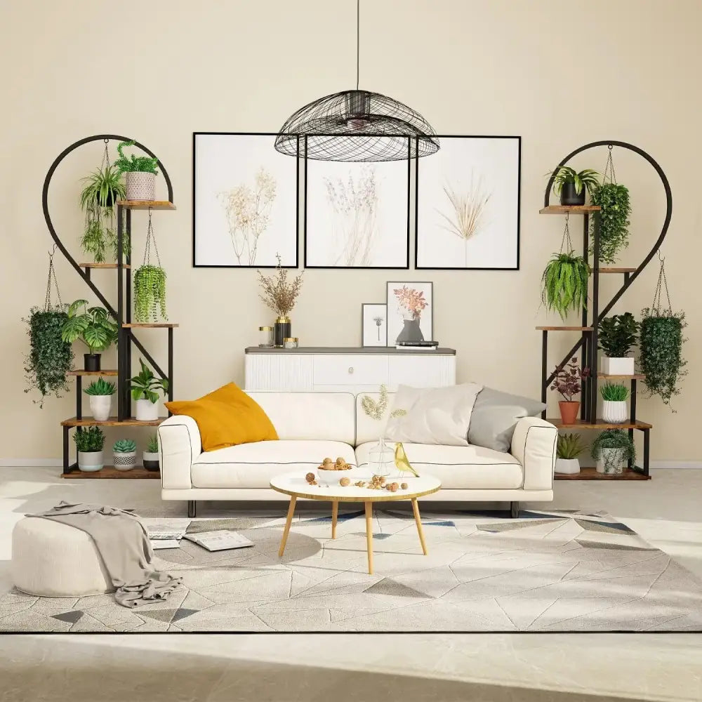 White sofa with mustard yellow pillow beside decorbites™ 6-tier heart shaped plant display stand in metal finish