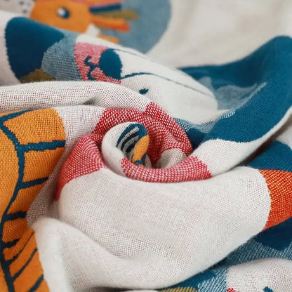A soft white cotton lions bath towel with a playful colorful cartoon animal pattern for quick dry use