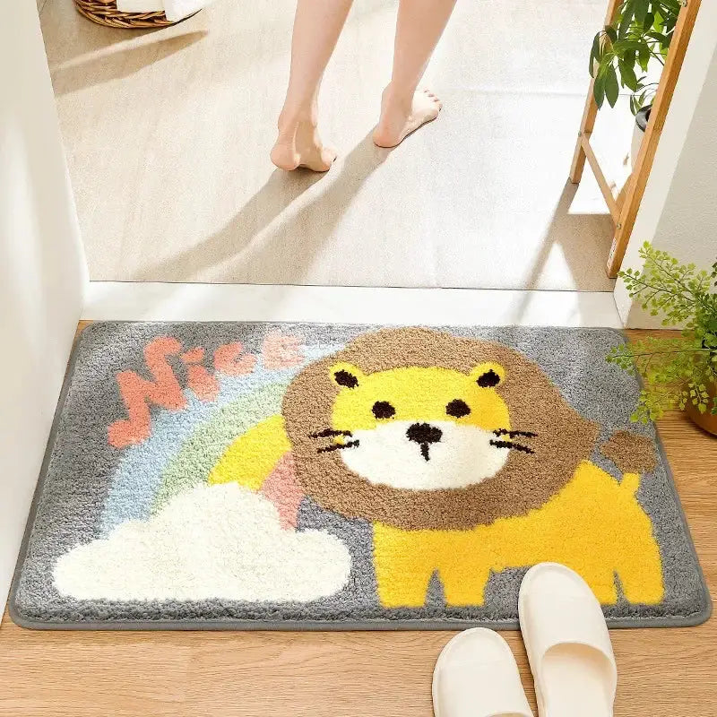 A plush gray bath rug featuring a cheerful yellow lion with a brown mane and a pastel rainbow for cartoon animal bathroom decorbites