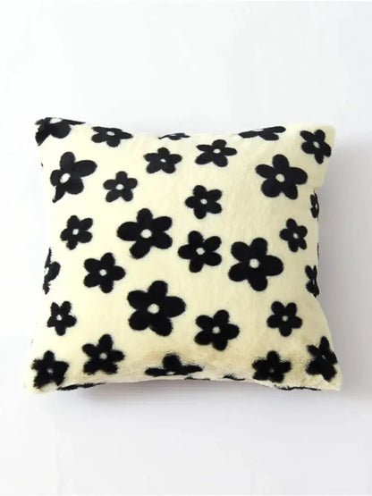 Cream-colored faux fur cushion cover with black white flower pattern for decorbites living room decor
