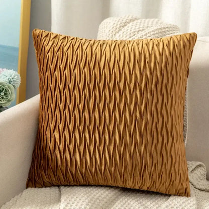 A square mustard-yellow cushion cover with textured pleated fabric contrasting decorbites houndstooth cushion cover