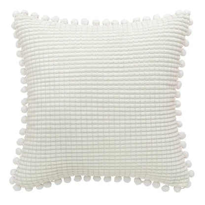 White textured cushion cover with waffle weave and pom-poms complements decorbites houndstooth cushion cover design