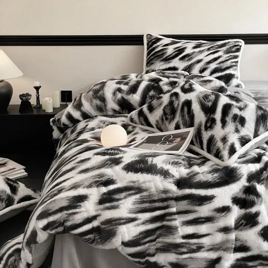Plush black and white leopard print bed set made of decorbites cozy rabbit hair for a warm bedroom ambiance