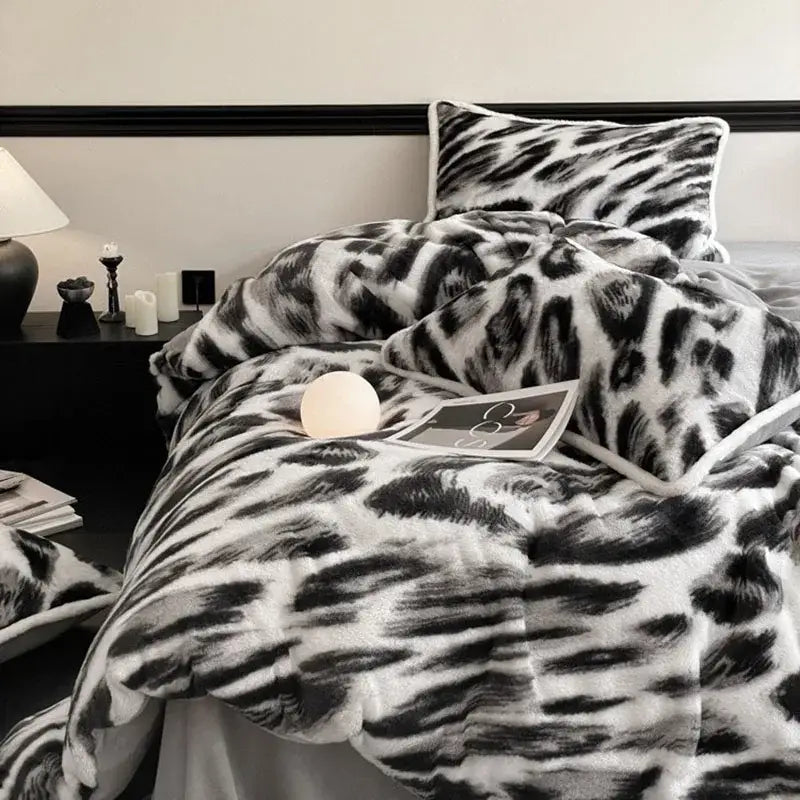 Plush black and white leopard print bed set made of decorbites cozy rabbit hair for a warm bedroom ambiance