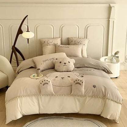 Cream-colored cotton bedding set with plush cartoon bear applique and soft textured fabric quilt cover