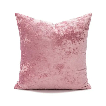 A plush dusty rose velvet pillow cover with dark grain texture ideal for living room decor