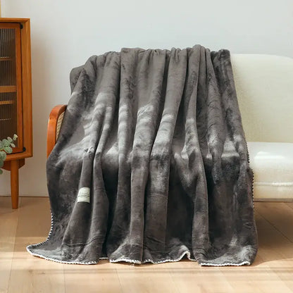 A plush dark gray double-layer warm blanket with soft velvety texture and white fringe trim for bedroom decor