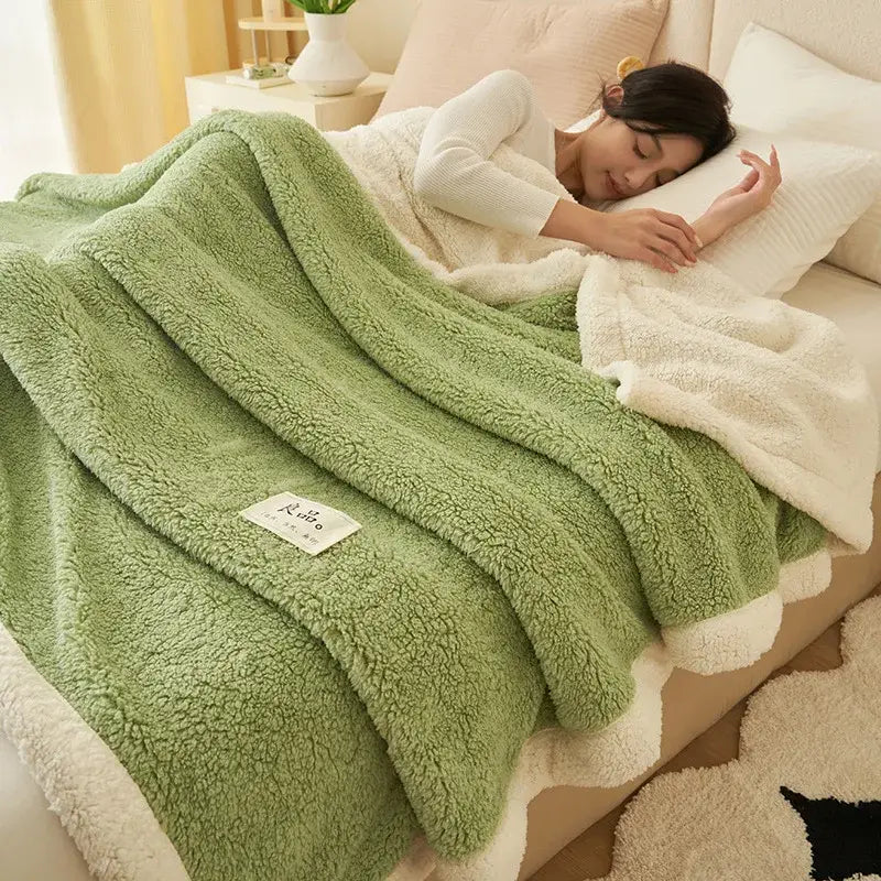 A cozy gray and cream decorbites coral fleece blanket with plush soft texture ideal for sofa or bedroom use