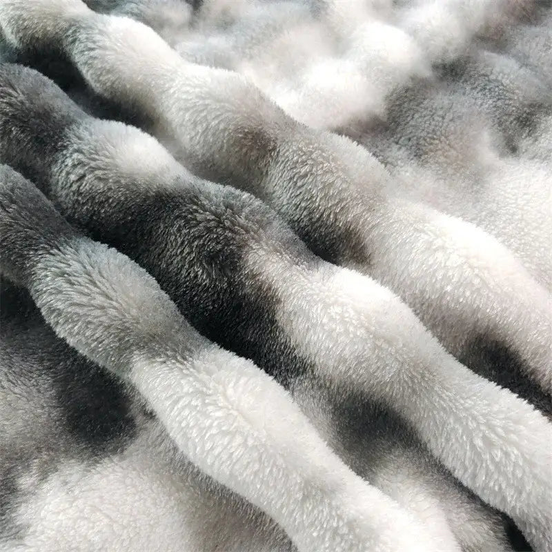 Plush gray gradient fleece throw blanket with a soft twisted fleece throw and cozy textured surface for living room use