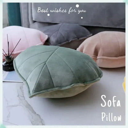 Soft sage green leaf shaped throw pillow with quilted texture and plush velvet finish for decorbites 3d leaf decor
