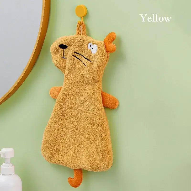Yellow plush dog-shaped hand towel with embroidered face and hanging loop made of double-layer coral velvet