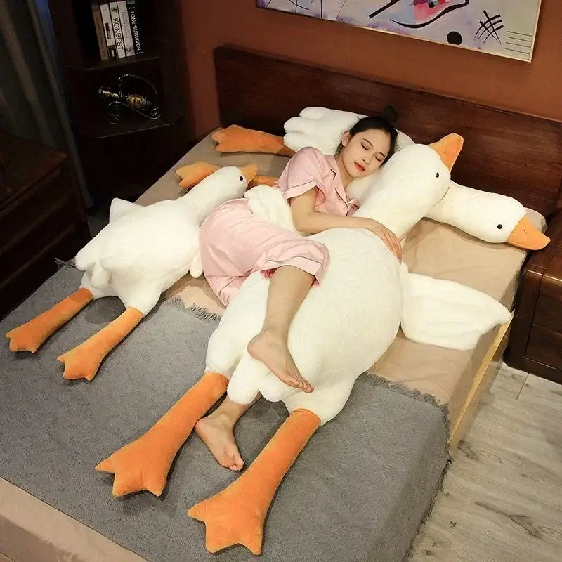 Plush white goose sleep body pillow with orange beak and feet designed for comfort and decorbites goose sleep use