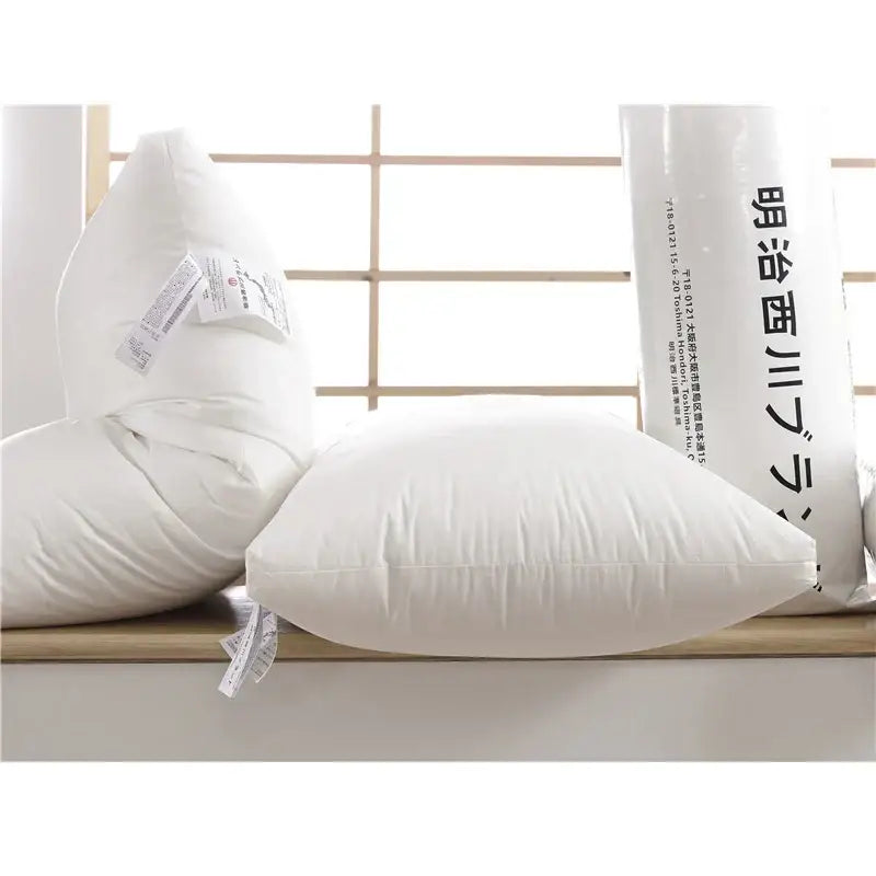 Plush white quilted cotton rectangle neck pillow with soft stitching details for decorbites bedroom decor