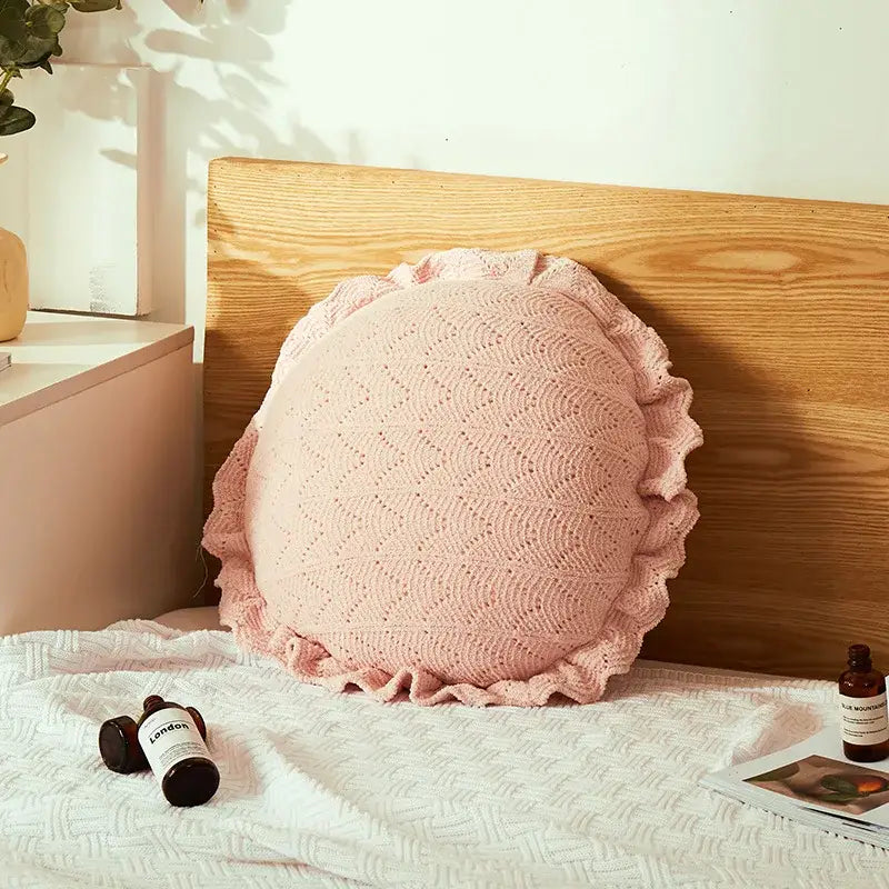 A soft pink knitted round pillow with ruffled edge and lace pattern for home decor and decorbites 3d flowers pillows collection