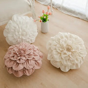 Three plush 3d flowers pillows in white and soft pink hues for home decor by decorbites