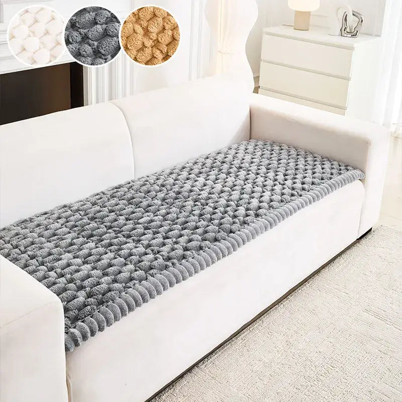 Gray plush pom-pom sofa cushion cover made of textured knitted fabric with anti slip feature for living room use