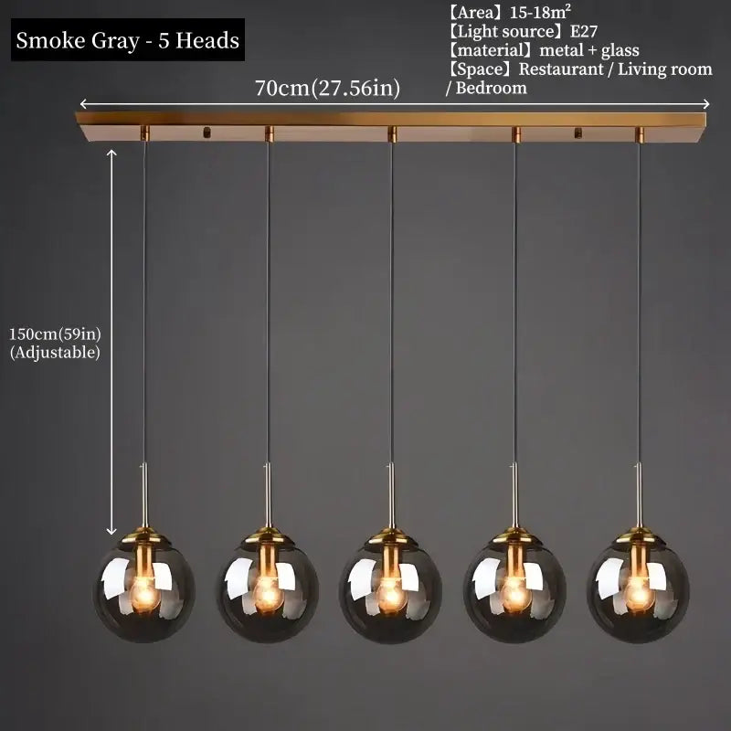 Smoke gray polished steel pendant light with five glass globe shades and brass-finished bar for dining room use