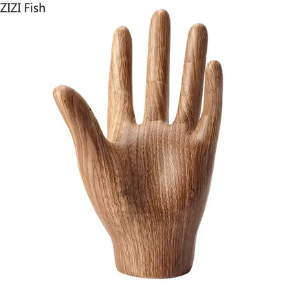 Polished wooden hand palm sculpture with natural wood grain finish and smooth contours for living room decor