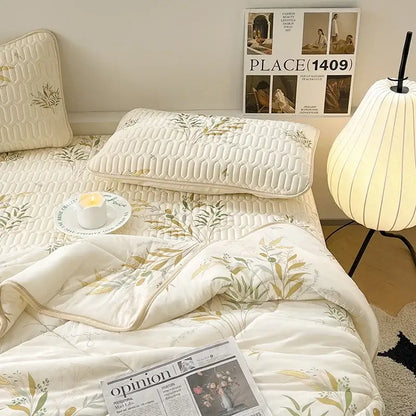 Cream-colored quilted comforter set with green and gold leaf patterns in polka dot smile white and red cool comforter set