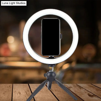 Portable black and white led ring light with smartphone mount on compact tripod stand compatible with 110v-120v and 220v-240v