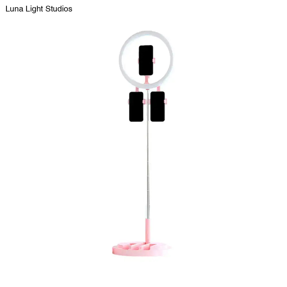 Portable pink and white led ring light bedroom stand with usb port and adjustable clips holding three phones in black white pink