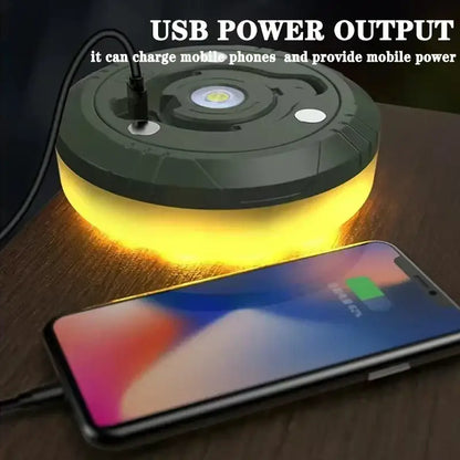Dark green circular portable power bank with glowing yellow base and usb port for camping light strip and garden tent decor