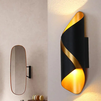 Modern black and gold spiral wall lamp with sleek curved design ideal as a living room wall light or tube bathroom fixture