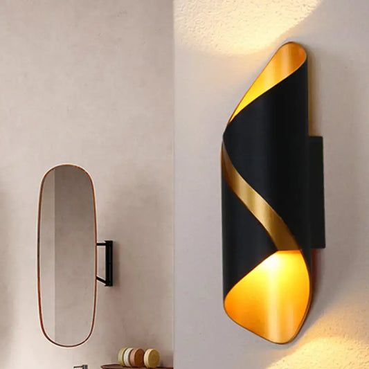 Modern black and gold spiral wall lamp with sleek curved design ideal as a living room wall light or tube bathroom fixture