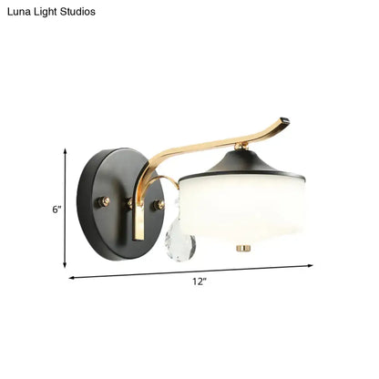 Post modern black and gold wall sconce with opal glass shade and crystal droplet accent for bedroom lighting