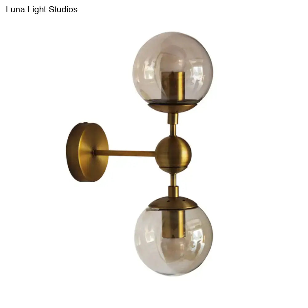 Post modern brass wall light with amber glass globes and e26 e27 sockets suitable for bedroom lighting